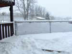 Snow stuck in fence.jpg
